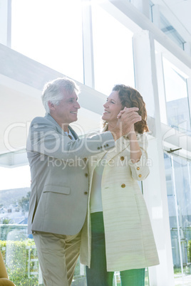 Joyful couple dancing