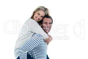 Portrait of man carrying woman piggyback