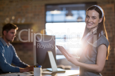 Smiling businesswoman using digital tablet