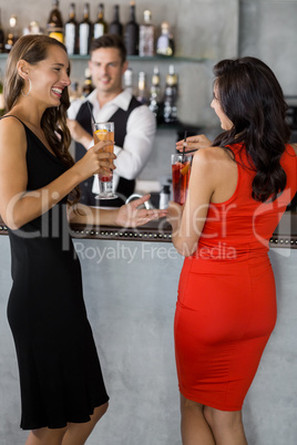 Two women having cocktail