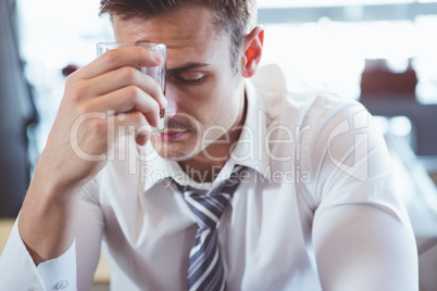 Depressed man having alcohol