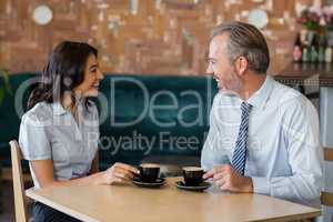 Man and woman meeting over coffee in restaurant