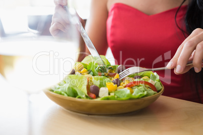 Woman having food salad