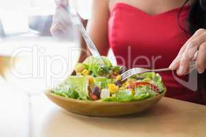 Woman having food salad