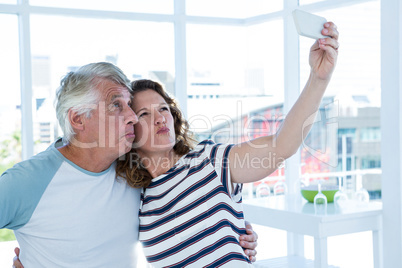 Mature couple taking selfie