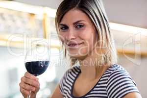 Beautiful young woman drinking wine