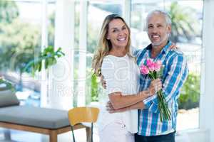 Mature couple embracing in restaurant