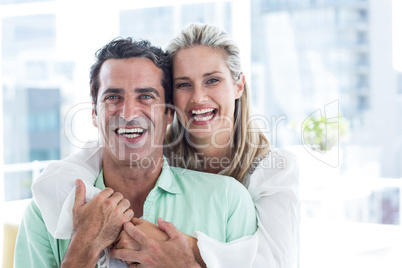 Portrait of mid adult couple embracing