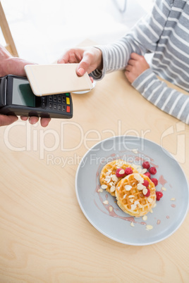 Woman making payment through NFC