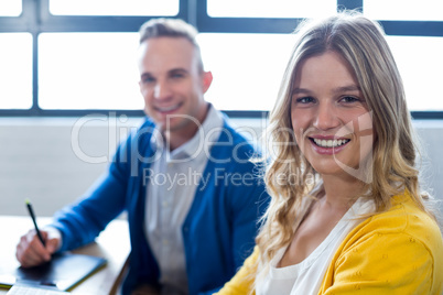 Portrait of happy colleagues in office