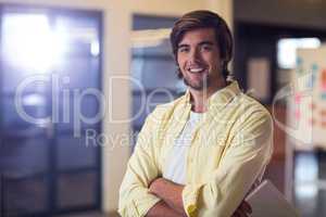 Young businessman with arms crossed