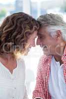 Smiling romantic couple in restaurant