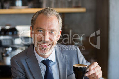 Businessman having coffee in cafÃ©