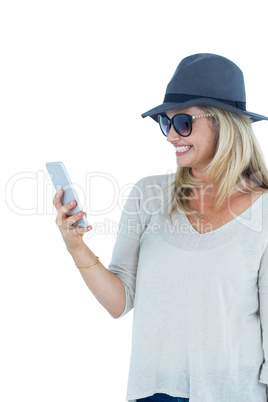 Cheerful woman using mobile phone