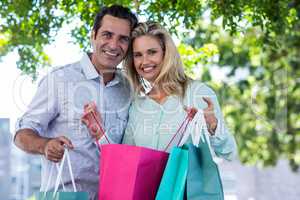 Smiling couple with shopping bags