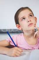 Schoolgirl doing homework in classroom