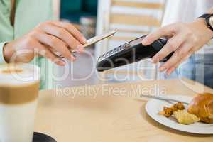 Customer making payment through smartphone