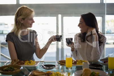 Business people having meal in restaurant