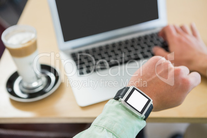 Man checking time on his smartwatch