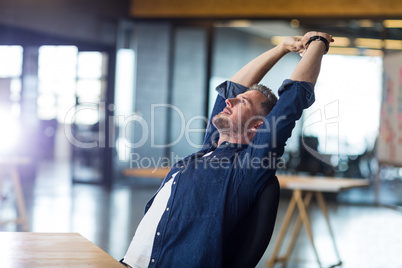 Relaxed man sitting in office