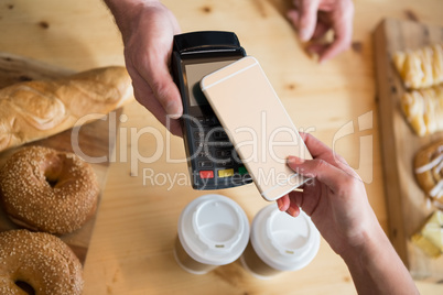 Woman making payment through NFC