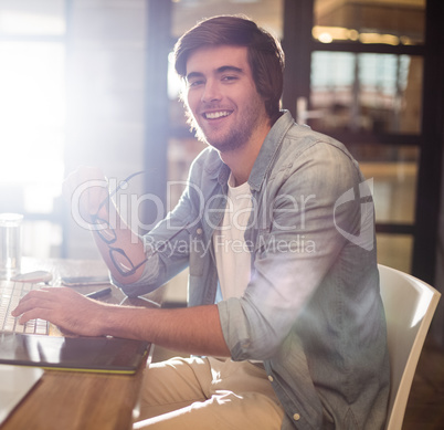 Portrait of man sitting in office