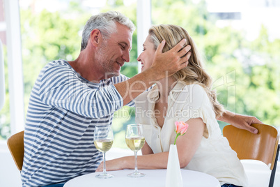 Romantic couple sitting at restaurant