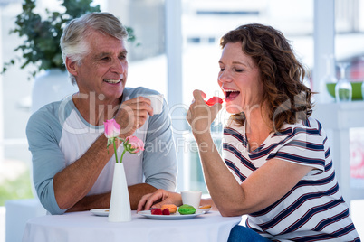 Woman with man eating food