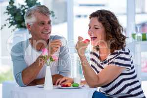 Woman with man eating food