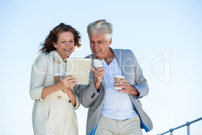 Couple using digital tablet