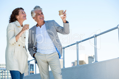 Joyful couple looking away