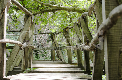 Old small bridge through a river