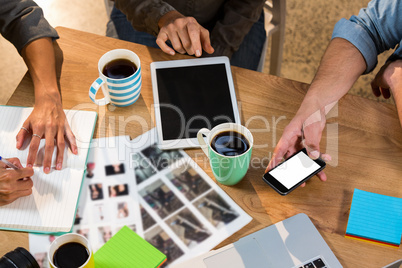 Creative business people working at table in office