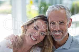 Close-up portrait of smiling mature couple