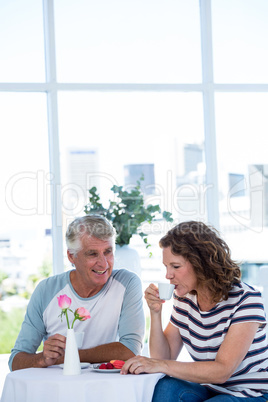 Woman with man drinking coffee at retaurant