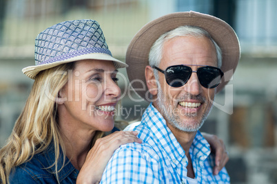 Close-up of mature couple in city