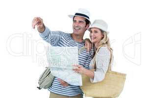 Couple pointing while holding map