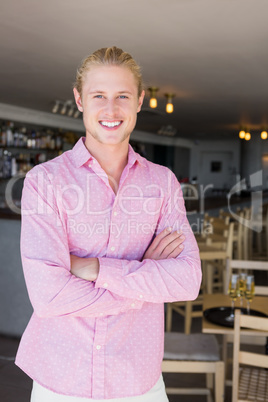 Portrait of restaurant manager with arms crossed