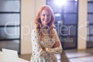 Businesswoman with arms crossed in office