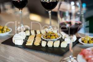 Wine and food arranged on table