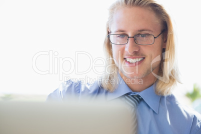 Happy man using laptop