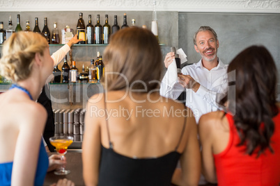 Female friends ordering drinks