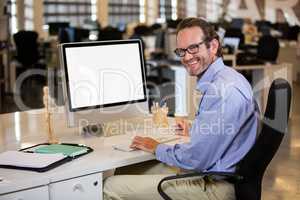 Businessman sitting at computer desk