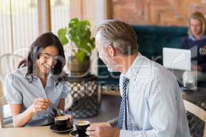 Man and woman meeting over coffee in restaurant