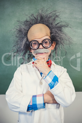 Portrait of schoolgirl pretending to be a teacher in classroom