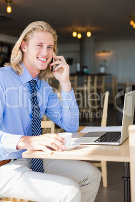 Happy man talking on mobile phone