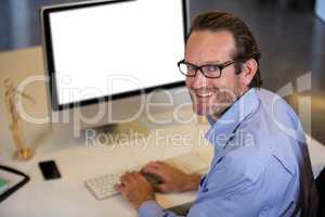 Creative businessman using computer at desk