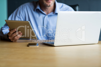 Man using laptop in creative office