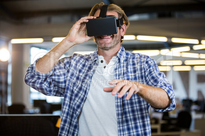 Creative businessman using virtual reality simulator