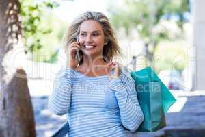 Woman talking on cellphone at street